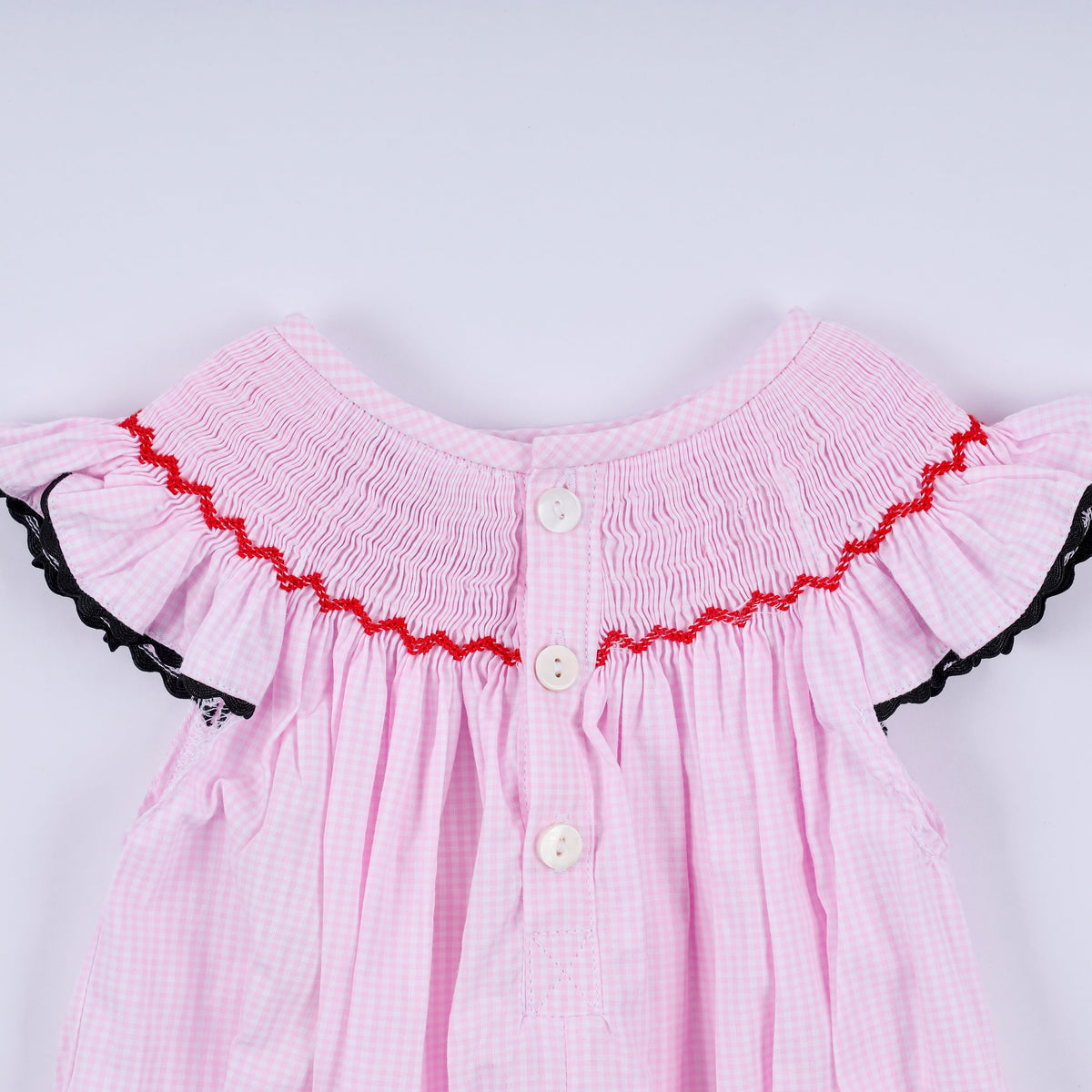 Red character hand smocked plaid ruffle bubble