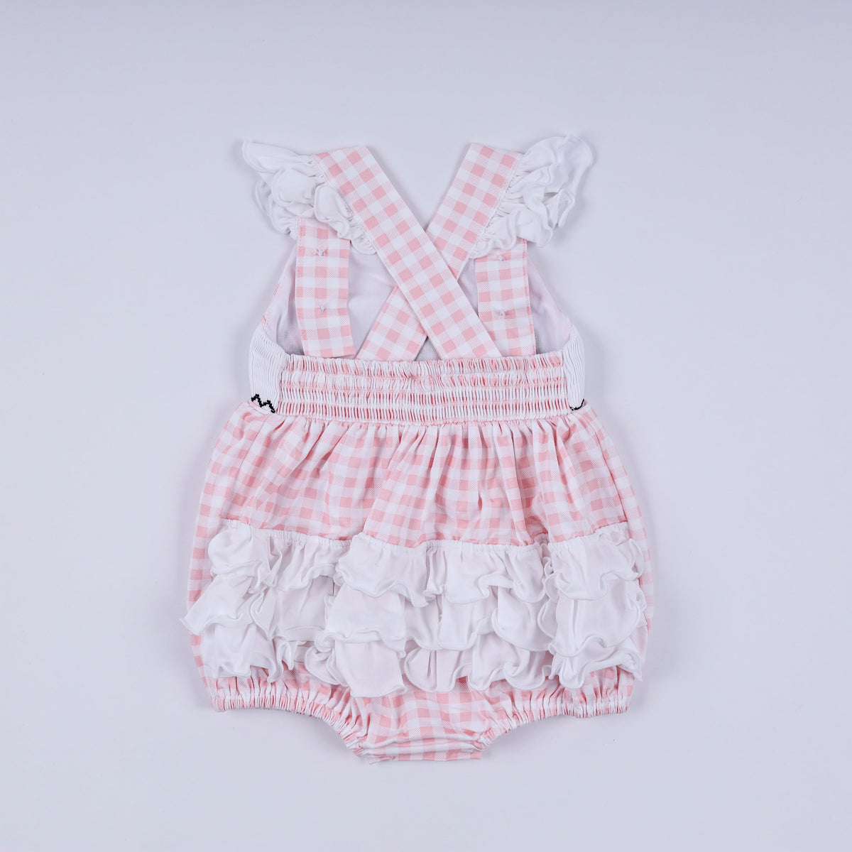 Pink character hand smocked gingham ruffle bubble