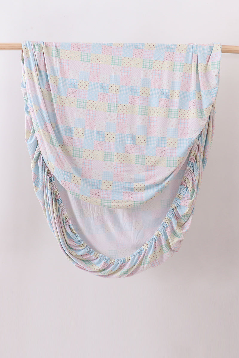 Pink floral checkered bamboo crib sheet